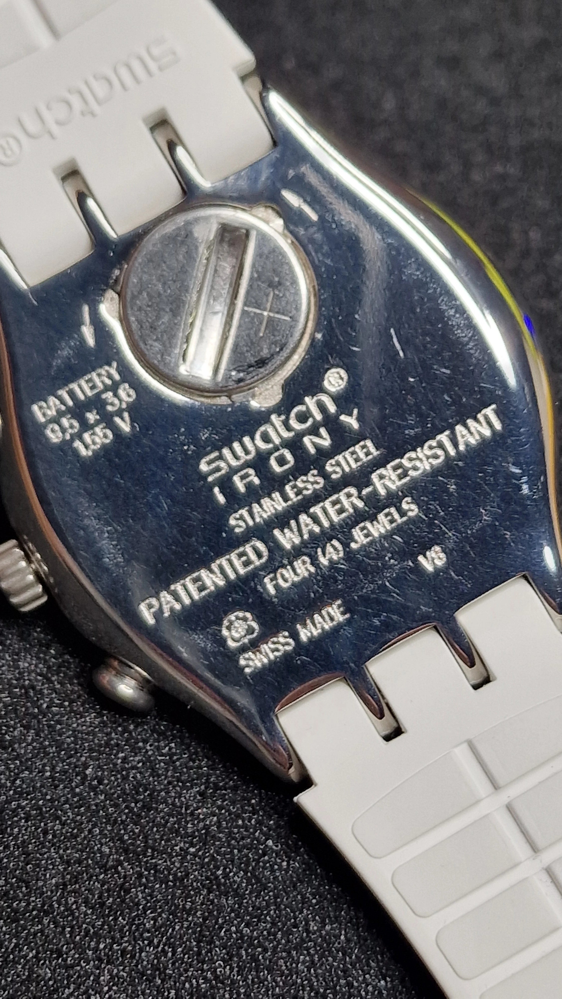 Swatch Irony Chrono YCS584 “Travel Chic” (AG 2014) – Clean silver dial + blue chrono hand 9